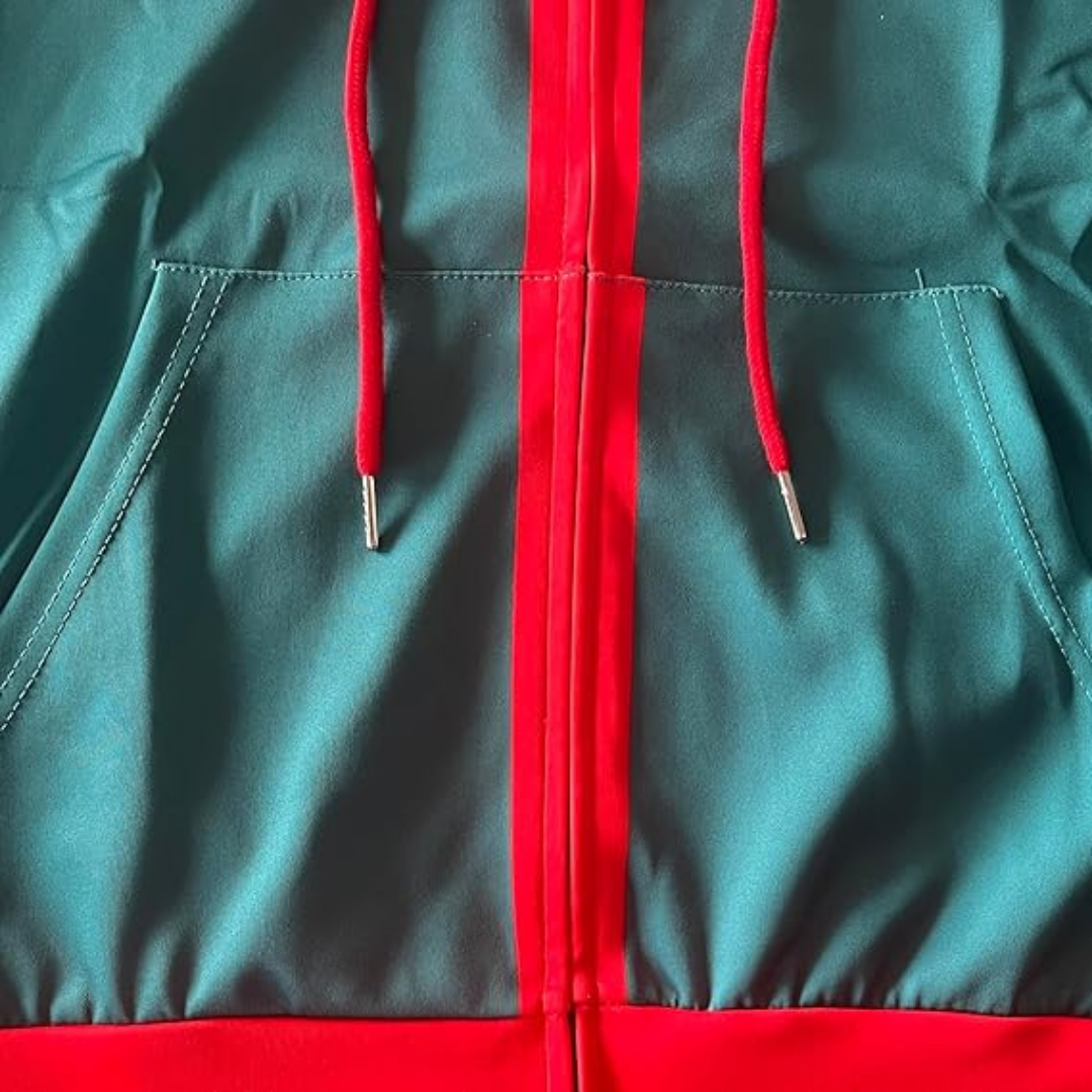 Front patch pockets, zipper, and drawstring detail on teal green hoodie